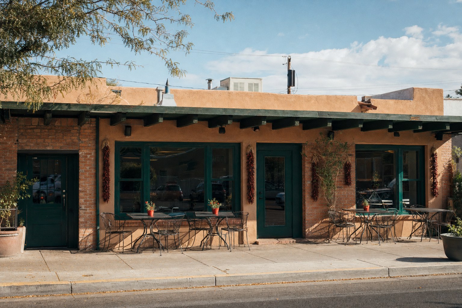 Trujeque’s Counter storefront on Central Avenue with patio tables in daylight